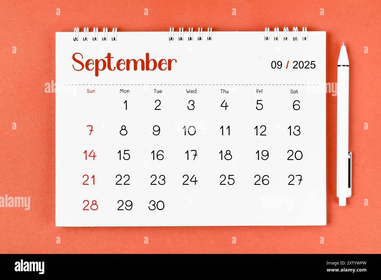 September 2025 Monthly Desk Calendar For 2025 Year And Pen On Red Background Stock Photo Alamy